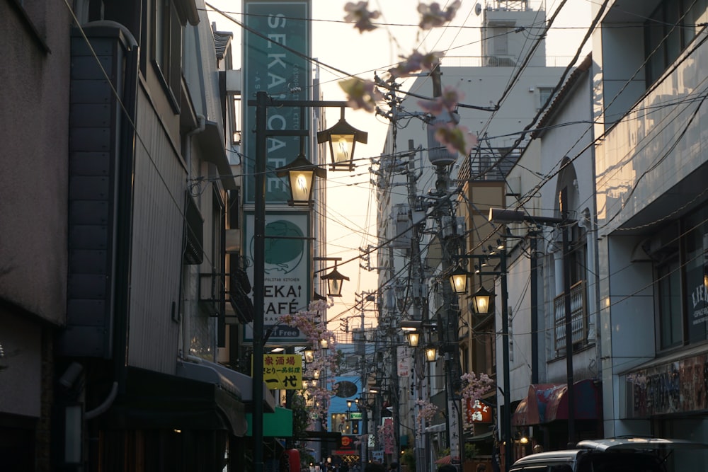 a city street filled with lots of traffic next to tall buildings