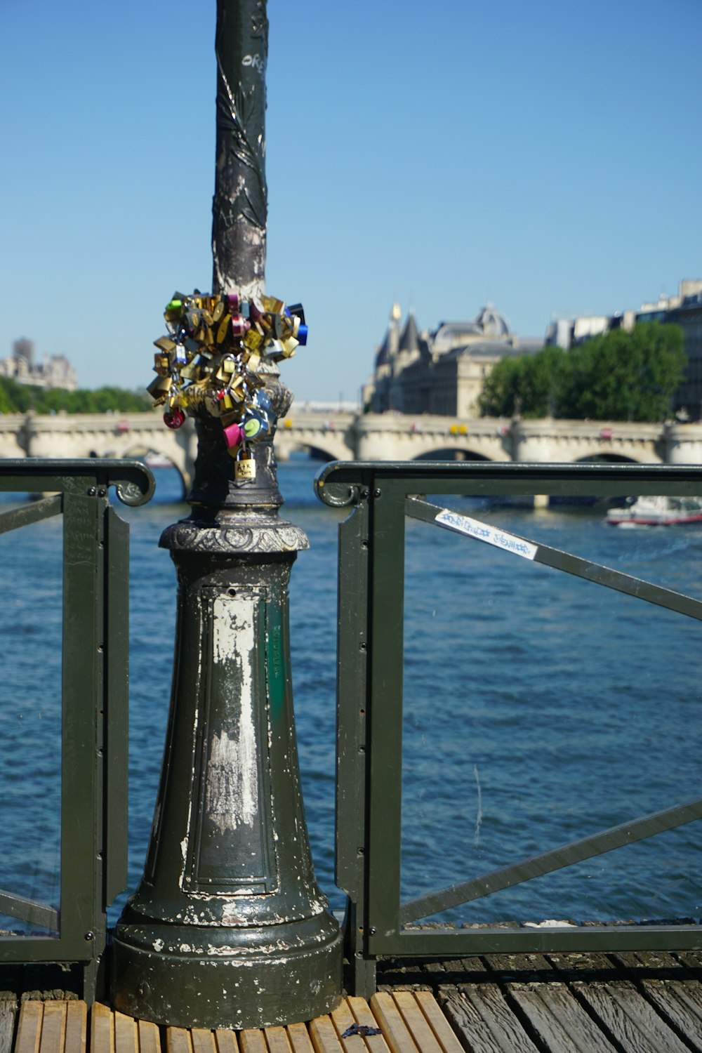 a lamp post with a bunch of flowers on top of it