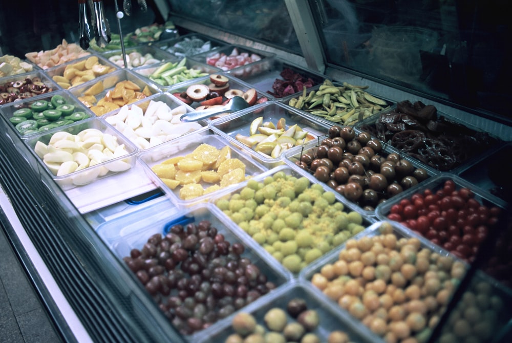 a display case filled with lots of different types of food