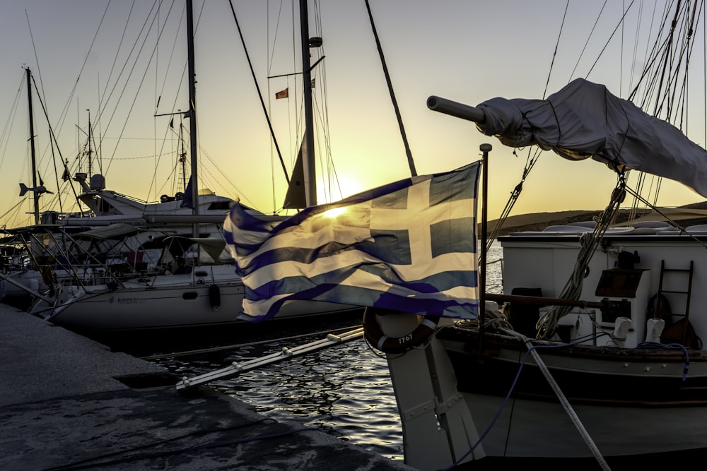 a group of sailboats sitting next to each other on a body of water