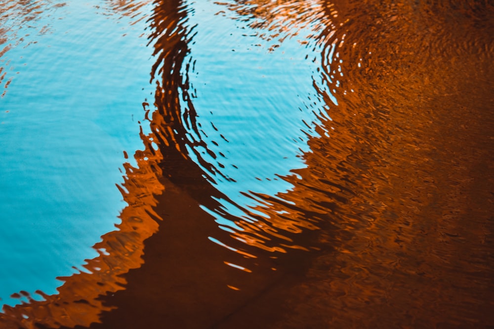 the reflection of a boat in the water