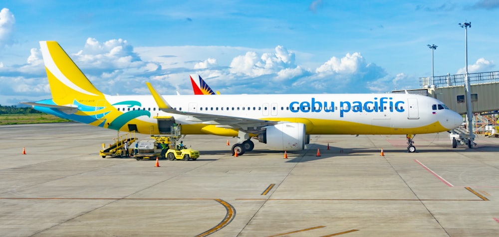 a large jetliner sitting on top of an airport tarmac