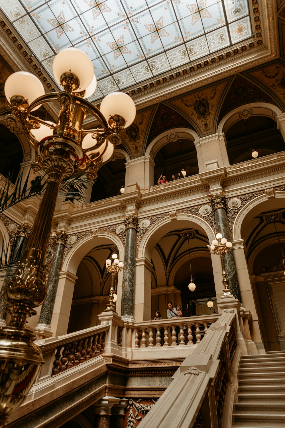 a staircase in a building with a skylight above it