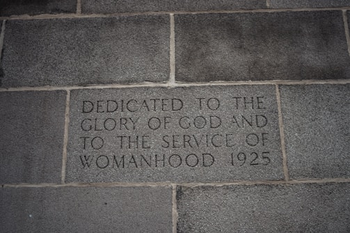 a brick wall with writing on it that says dedicated to the glory of god and