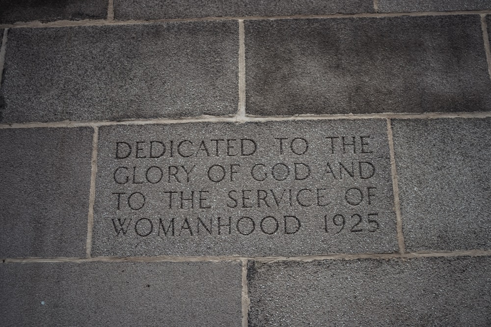 a brick wall with writing on it that says dedicated to the glory of god and