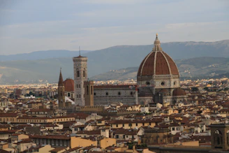 Visitors walking on the rooftop terraces of the Duomo, with panoramic views of Milan’s skyline.