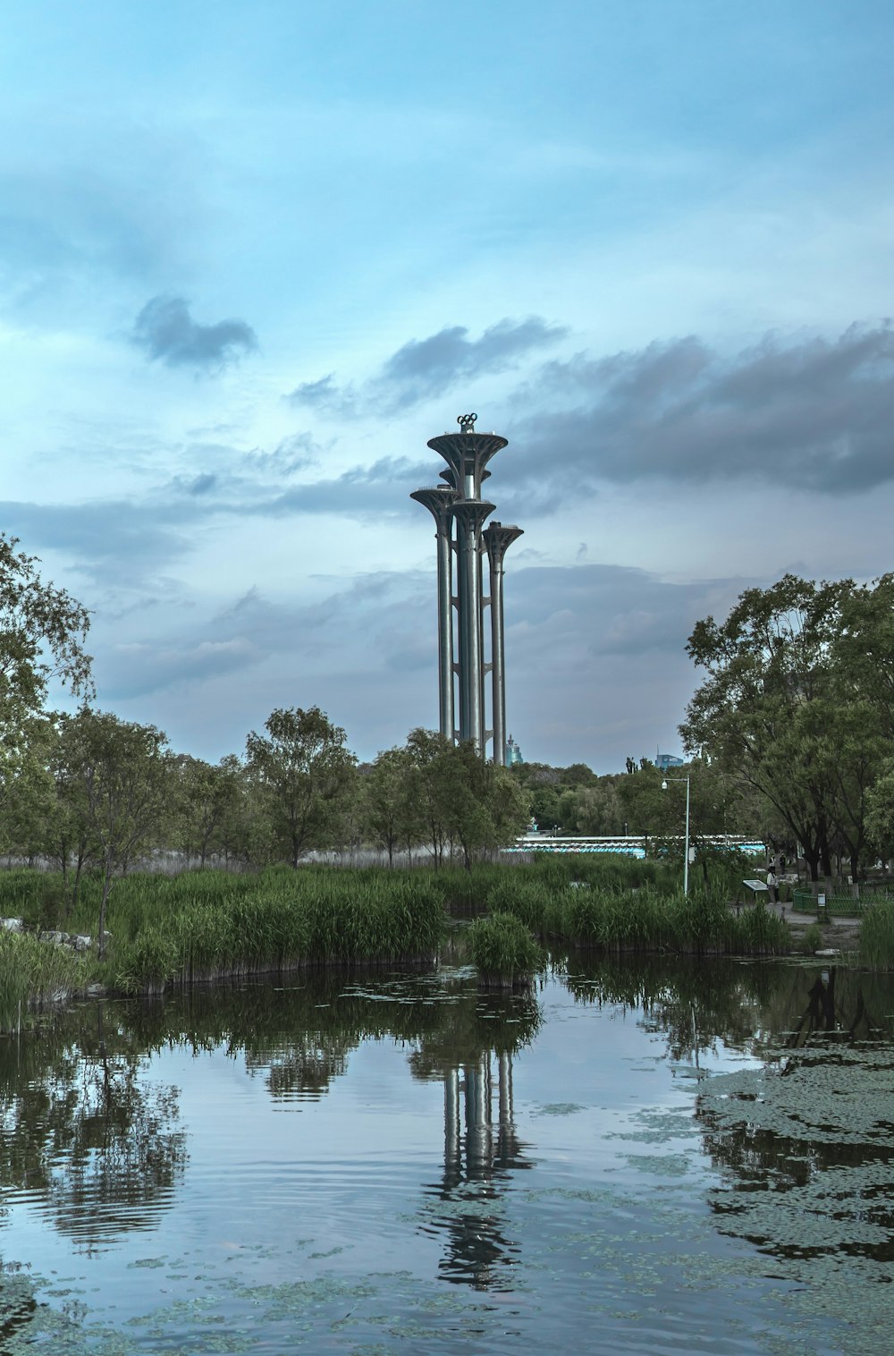 a large tower sitting next to a body of water