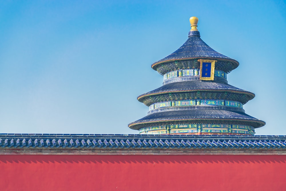 a tall tower with a blue sky in the background