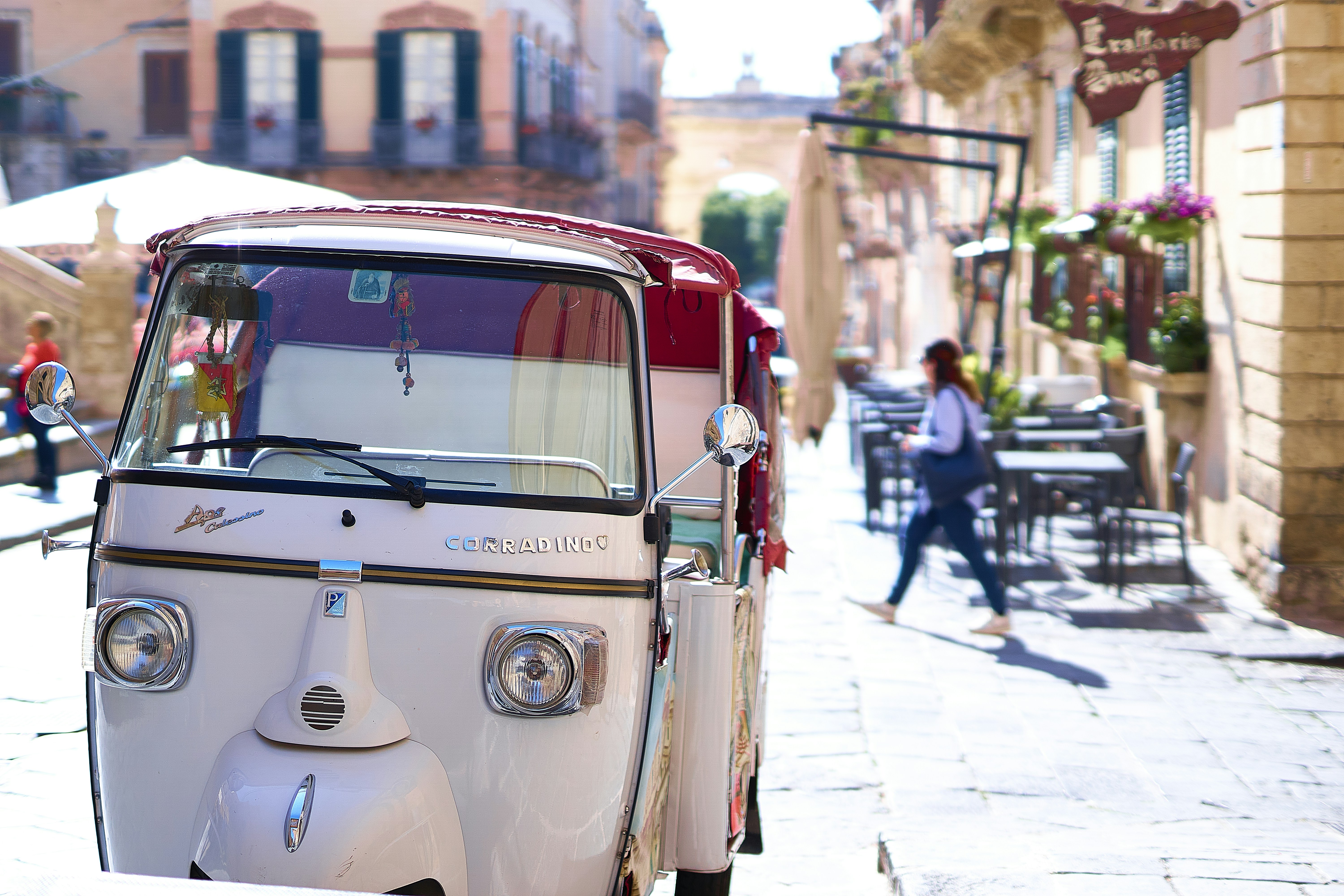 a small car parked on the side of a street