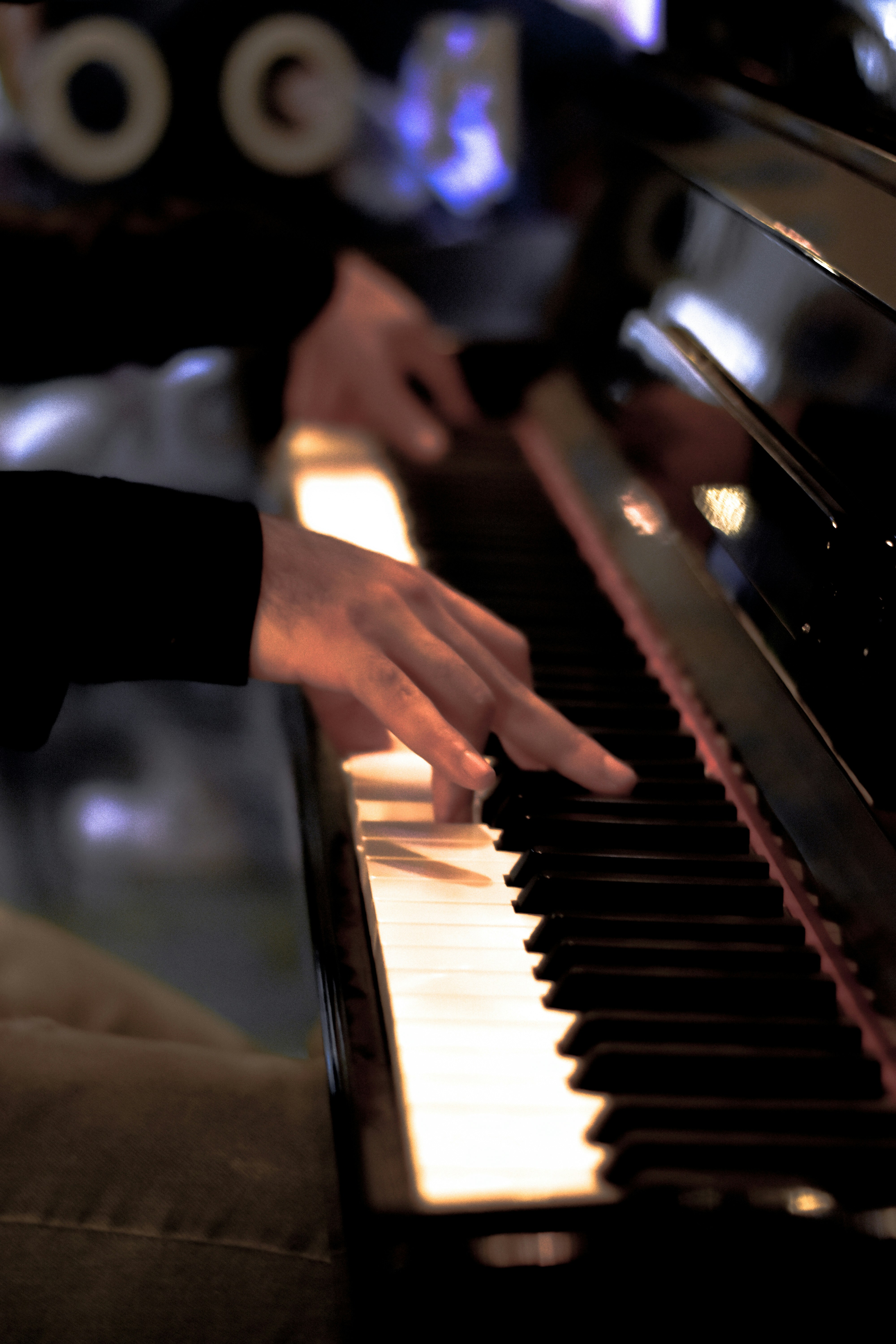 a close up of a person playing a piano