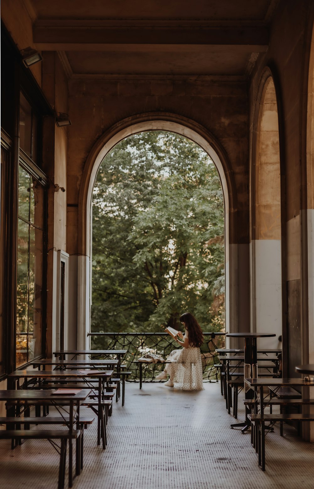 a woman sitting on a bench in a church