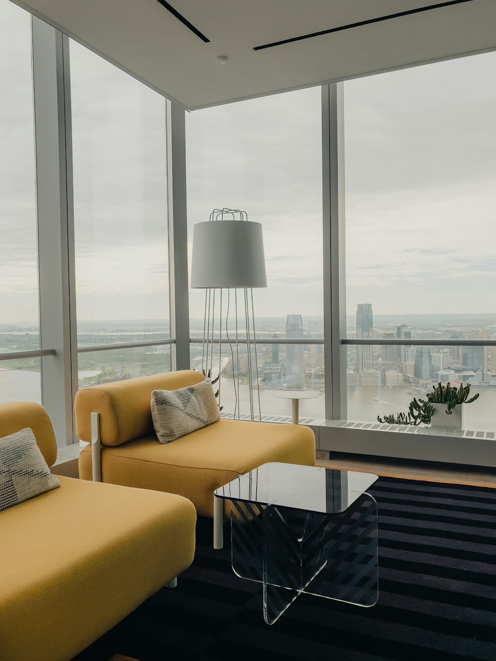 a living room filled with furniture and a large window