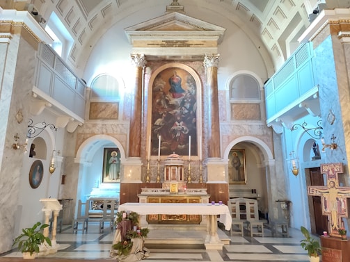 A serene view of the ancient church altar adorned with traditional Orthodox icons and candles.