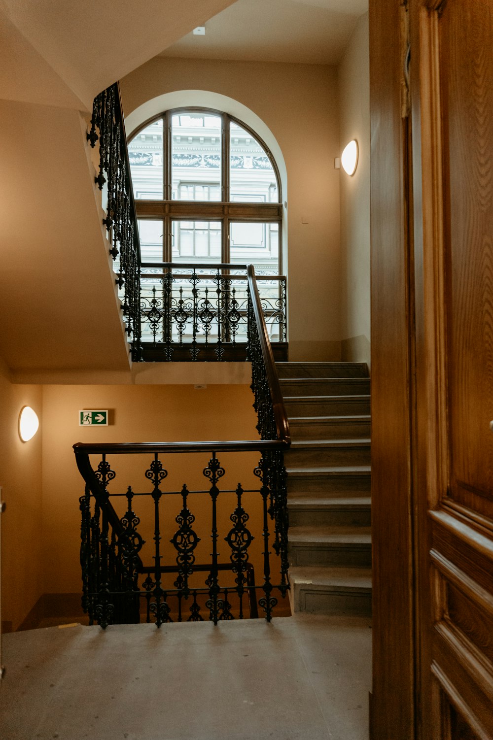 a staircase leading to a large window in a building