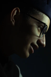 Elegant side profile of a model wearing lightweight DutchOptik glasses in natural light.