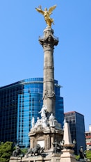 a statue with a golden angel on top of it