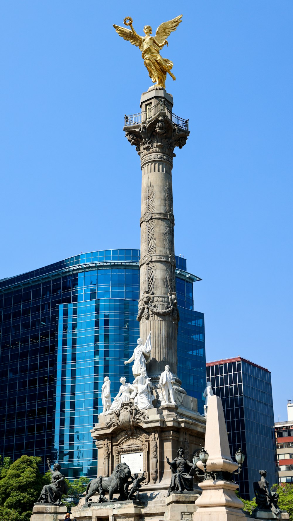 a statue with a golden angel on top of it