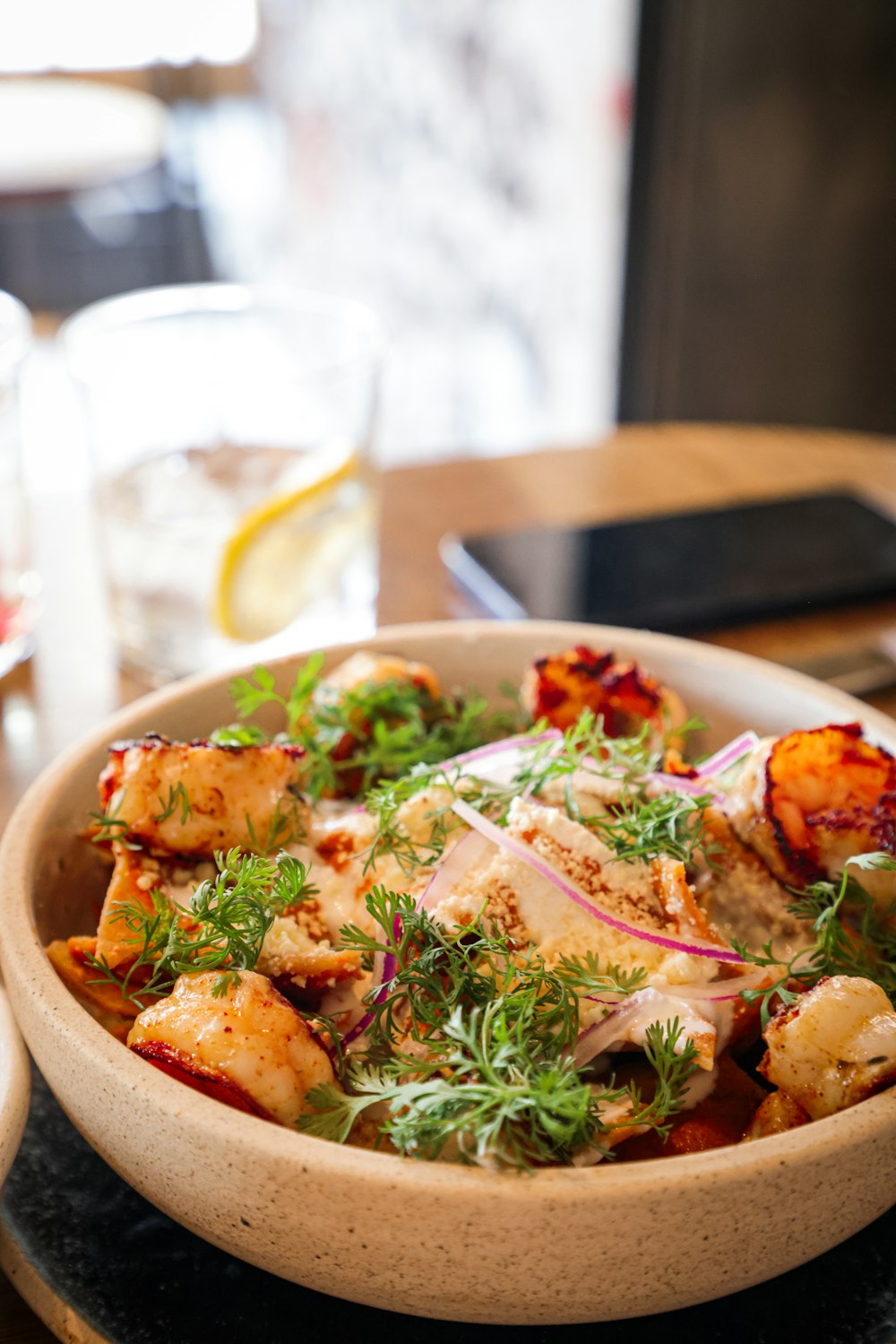 a bowl of food sitting on a table