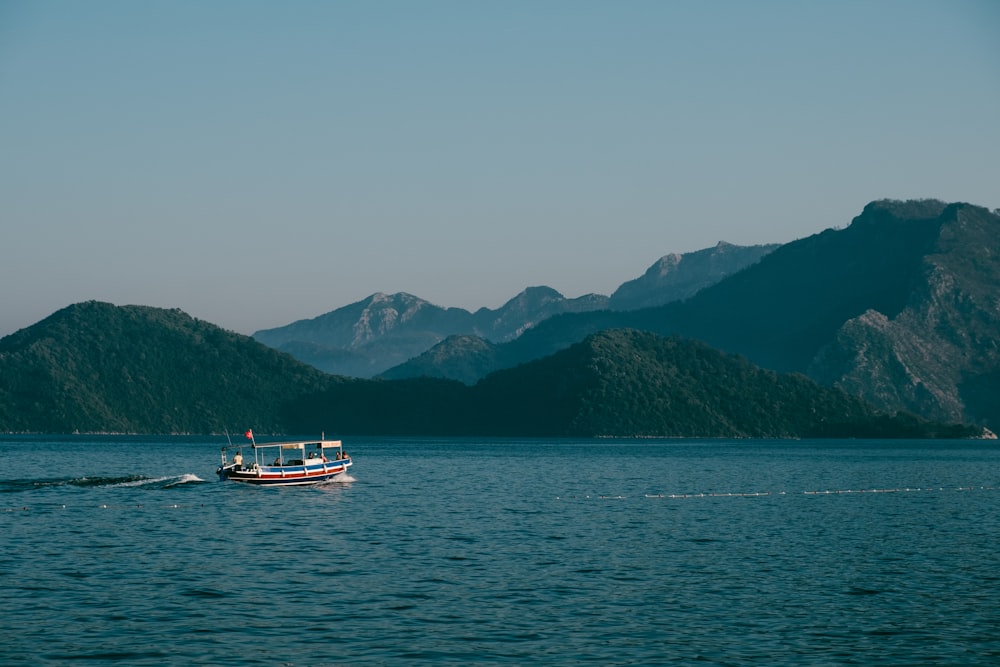 a small boat in a large body of water