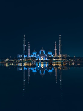 a large body of water with a building in the background