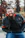 a man with a beard sitting on a bench