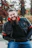 a man with a beard sitting on a bench