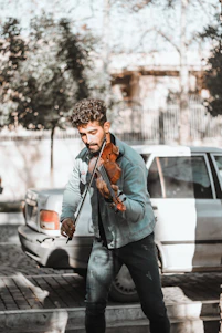 a man playing a violin on the street