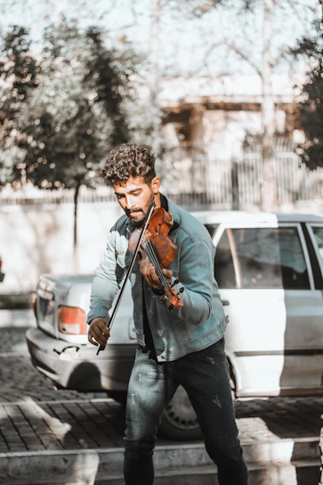 a man playing a violin on the street
