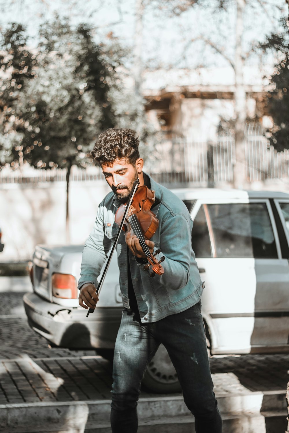 a man playing a violin on the street