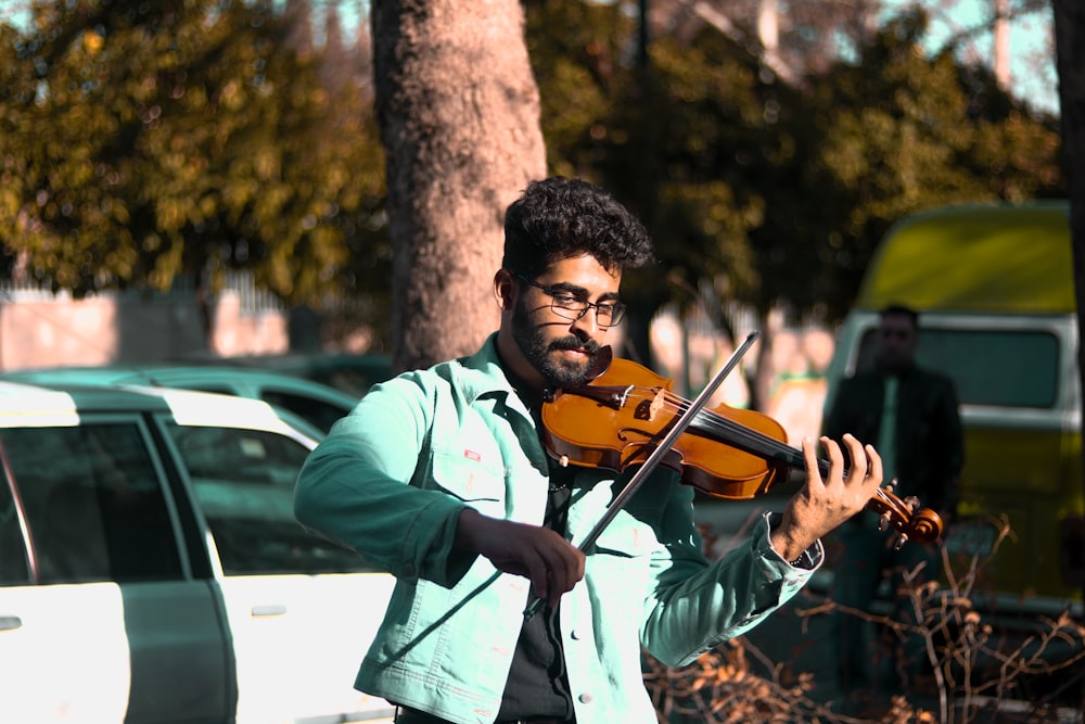 a man playing a violin on the street