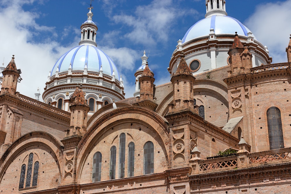 a large building with two blue domes on top of it