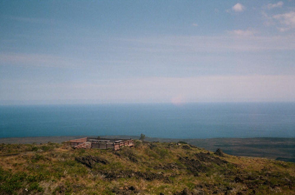 a house on a hill overlooking the ocean