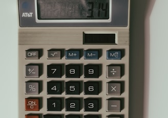 a calculator sitting on top of a white table