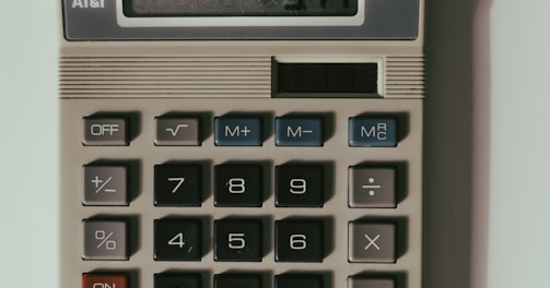 a calculator sitting on top of a white table