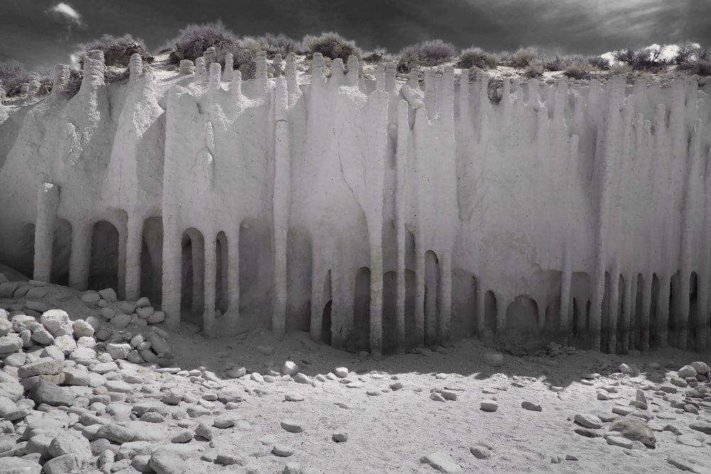 a black and white photo of a wall of ice