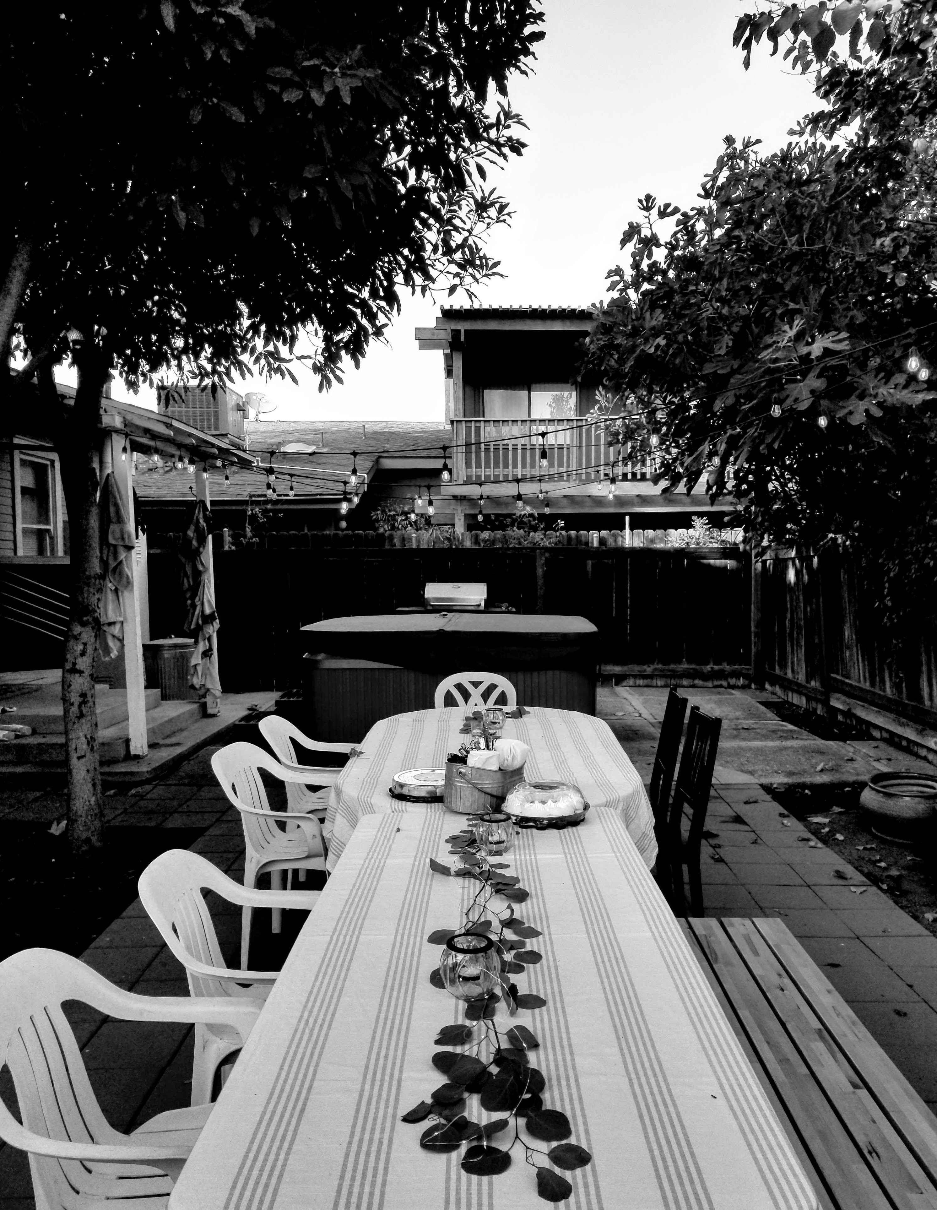 Elegant brick paver patio with outdoor furniture and string lights in a Tennessee backyard