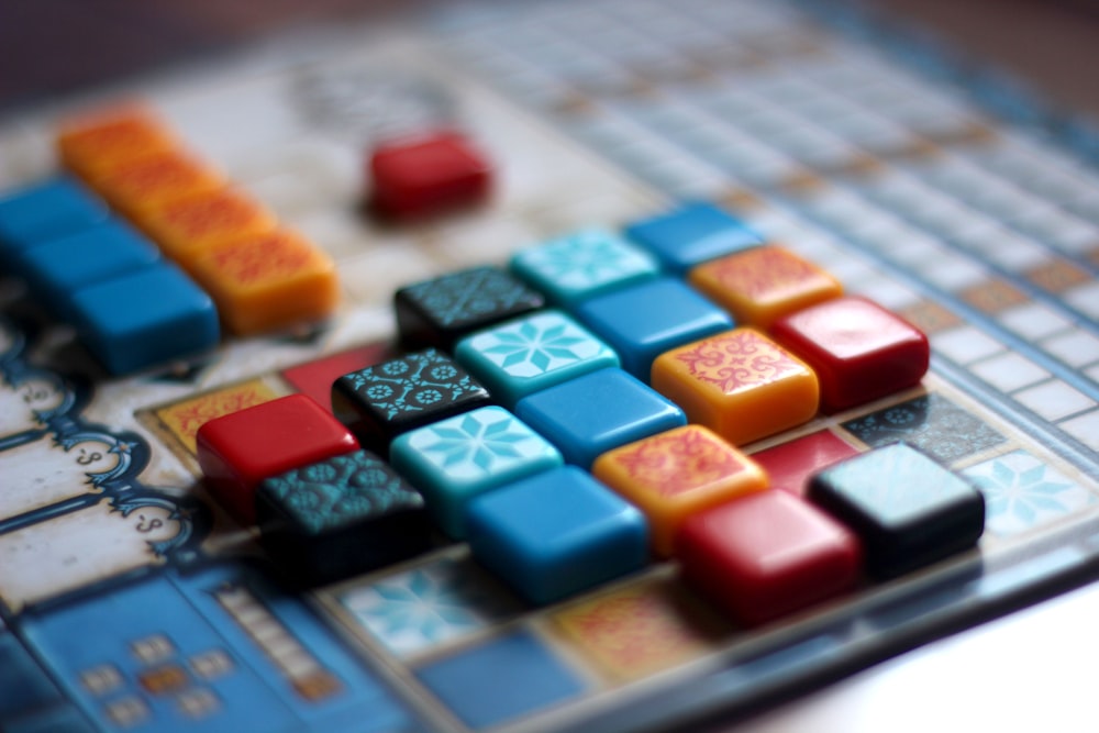 a close up of a game board with many different colored blocks