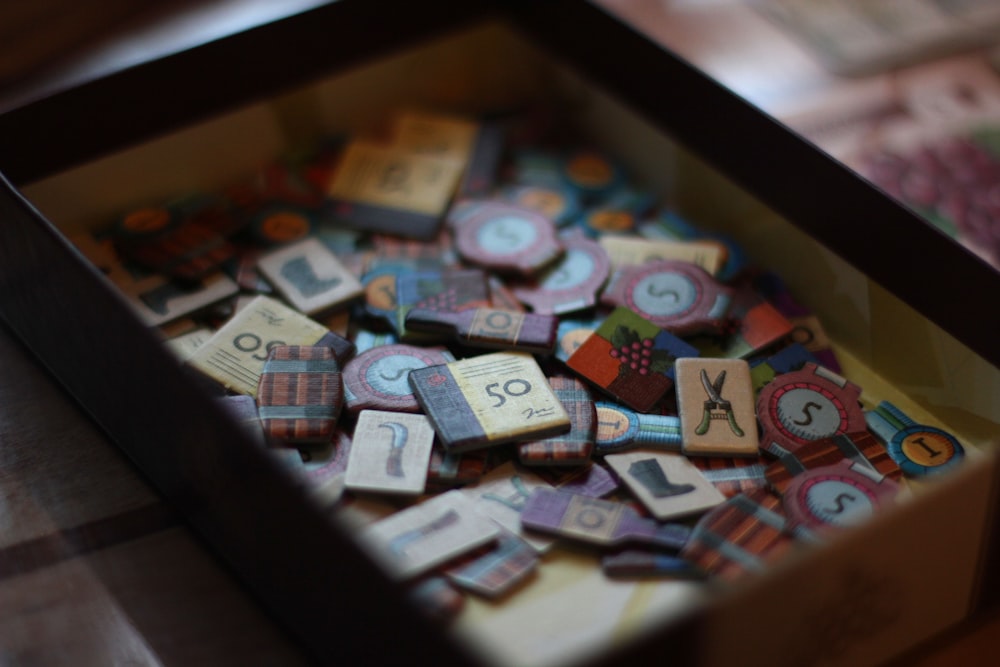 a box filled with lots of wooden letters