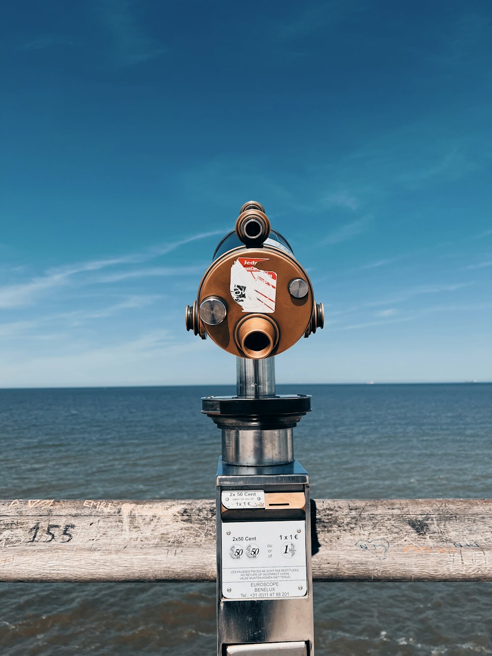 a close up of a metal object near the ocean