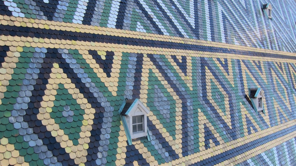 a close up of a colorful building with a window