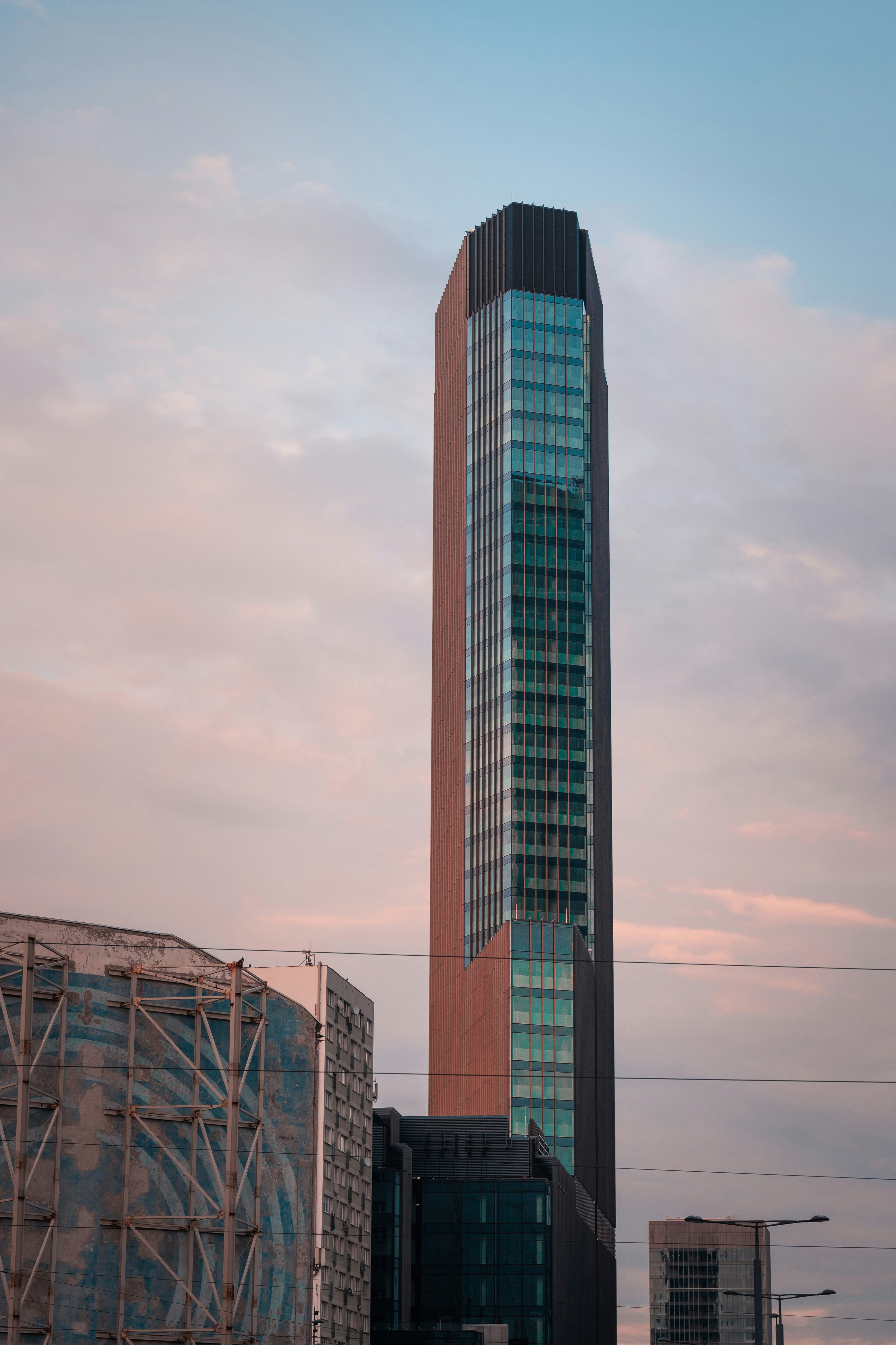 a tall building with a sky background