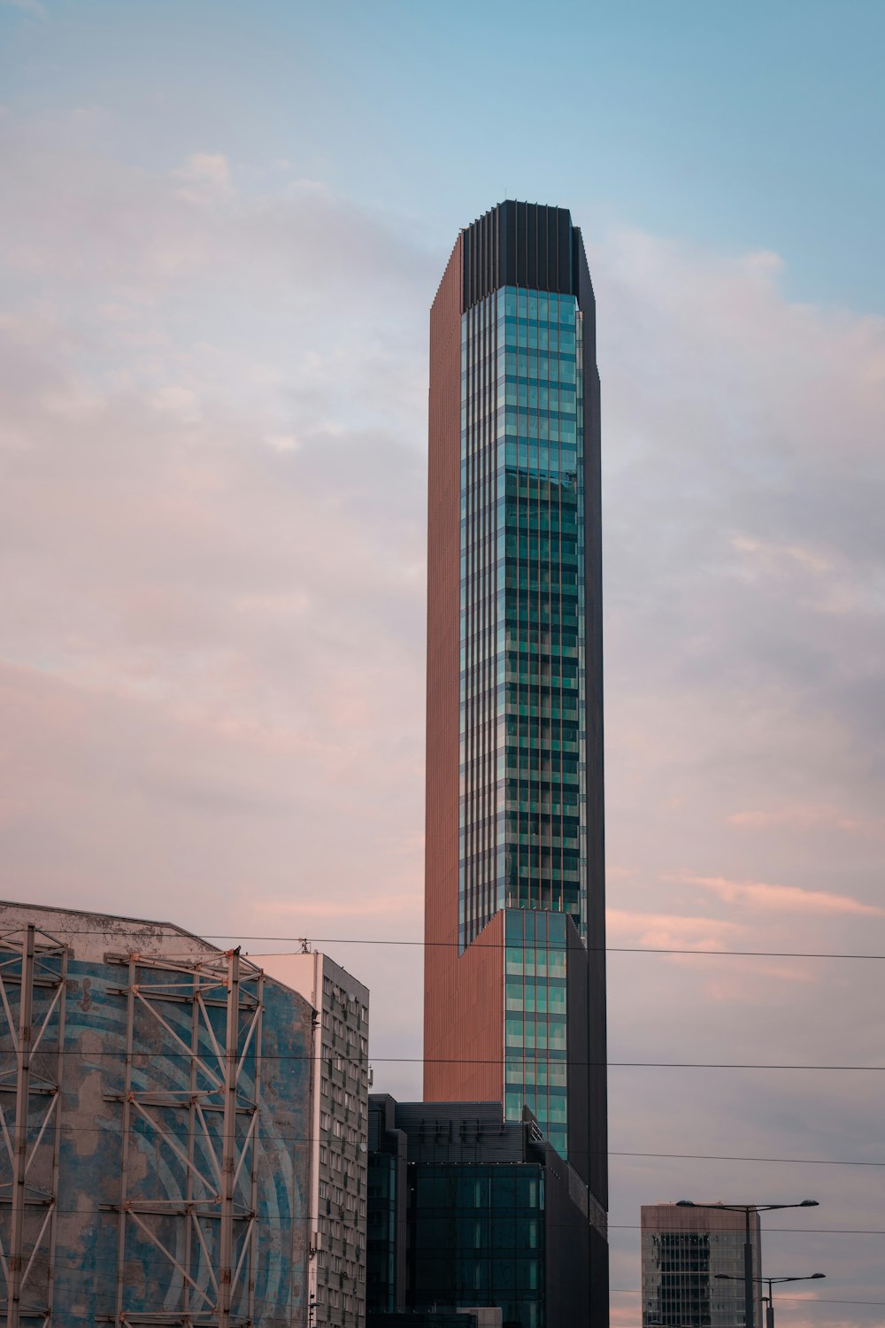 a tall building with a sky background