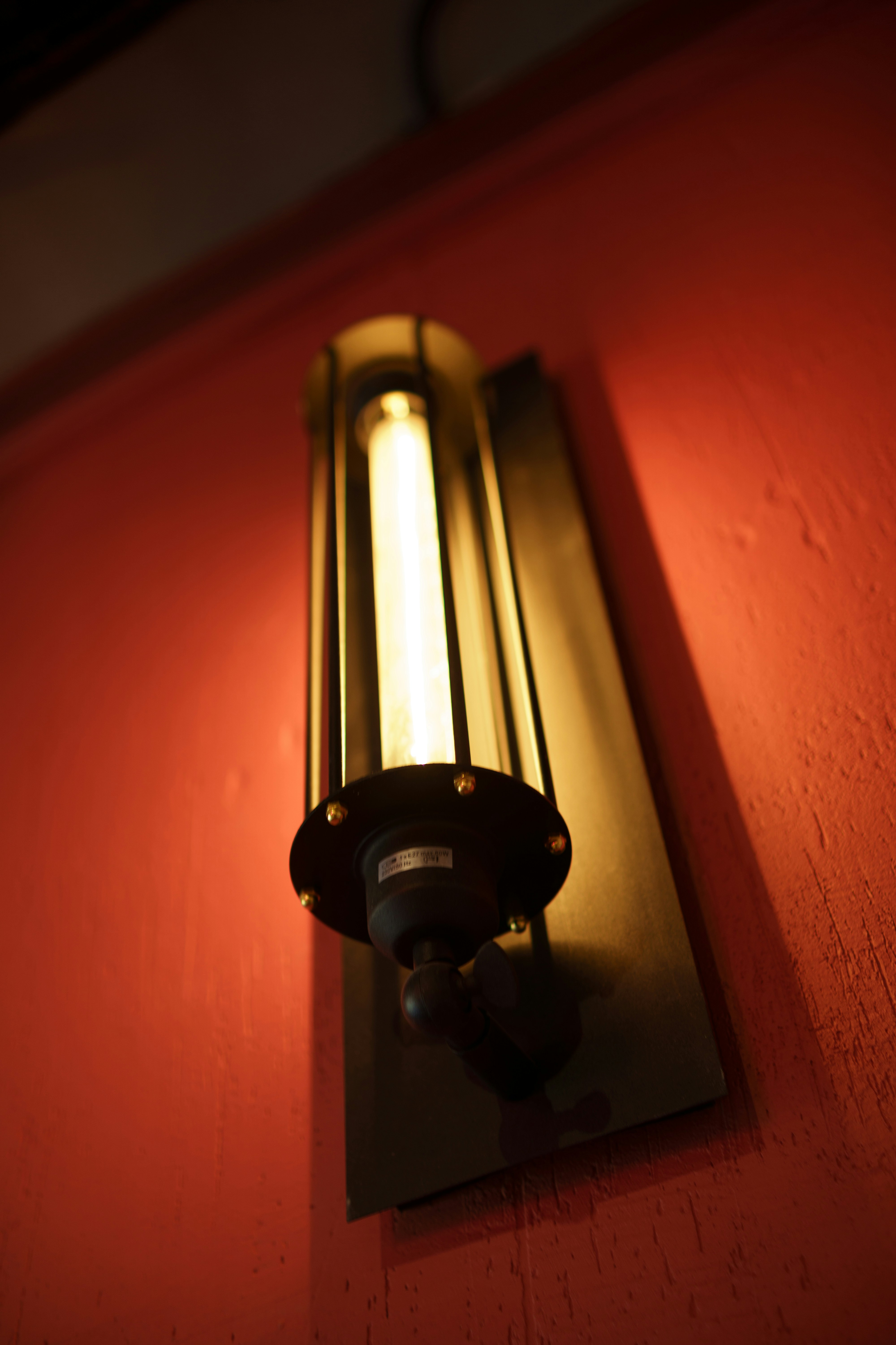a light that is on a red wall