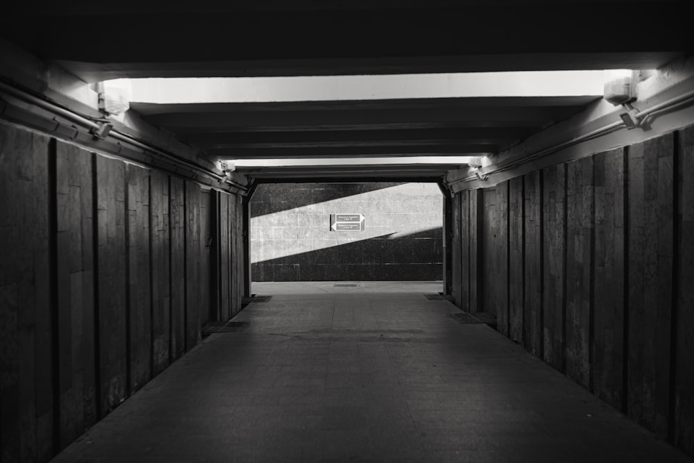 a long hallway with a basketball hoop in the middle