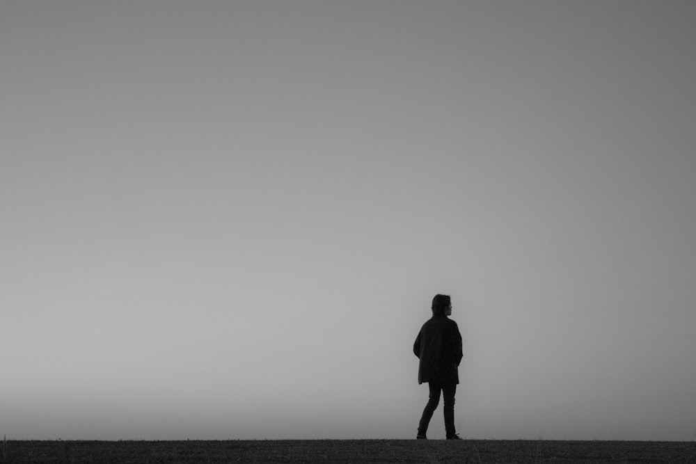 a person standing in the middle of a field