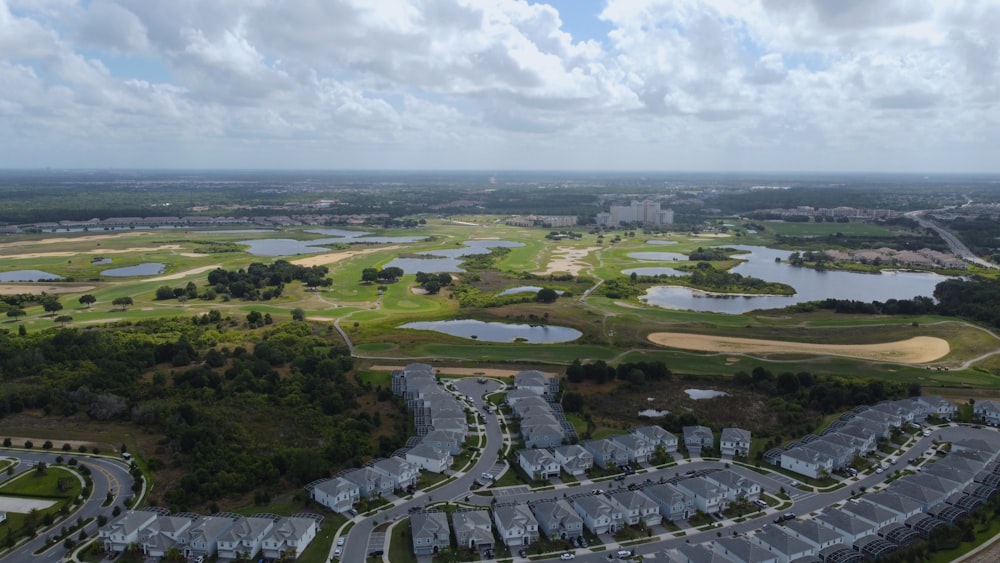 a bird's eye view of a golf course surrounded by water