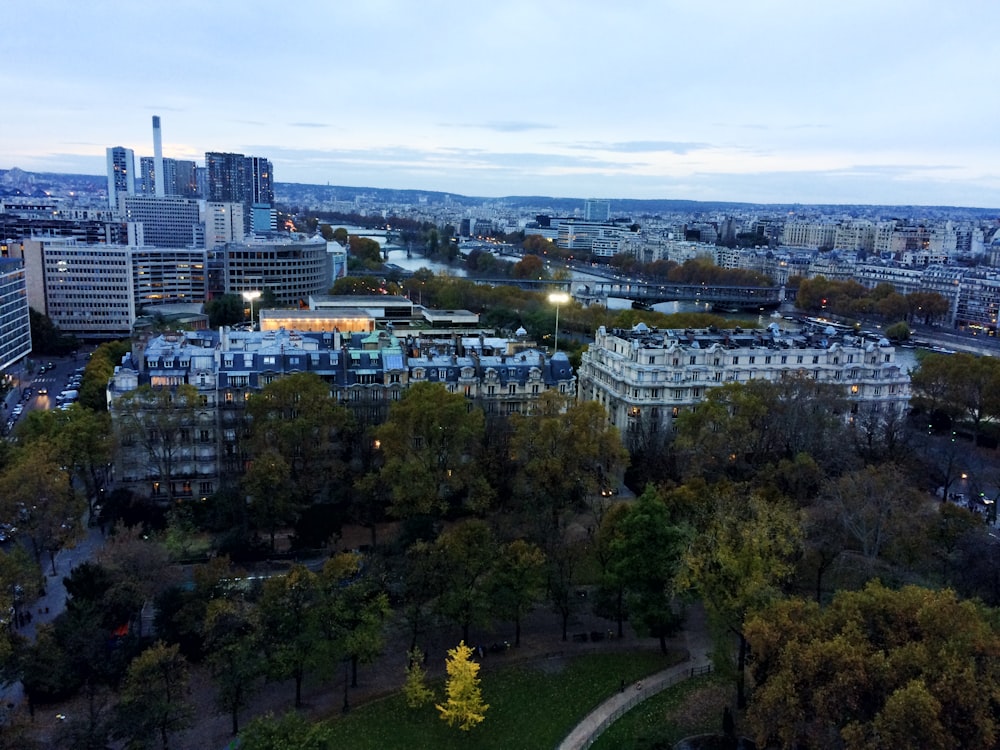 an aerial view of a city at dusk