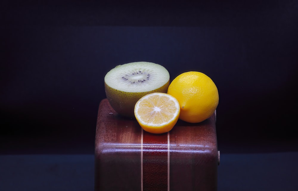a piece of fruit sitting on top of a wooden box