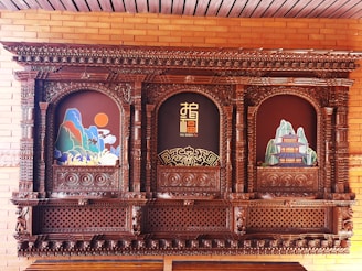 Chinese zodiac symbols carved into a traditional wooden panel.