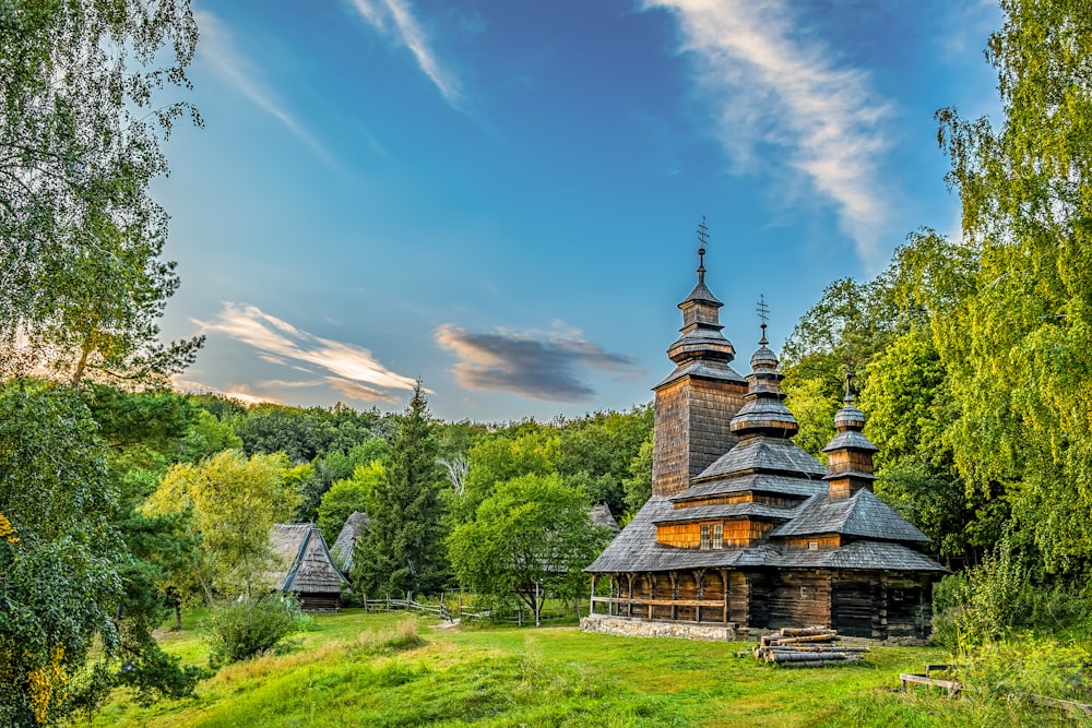 an old wooden church in a forest setting